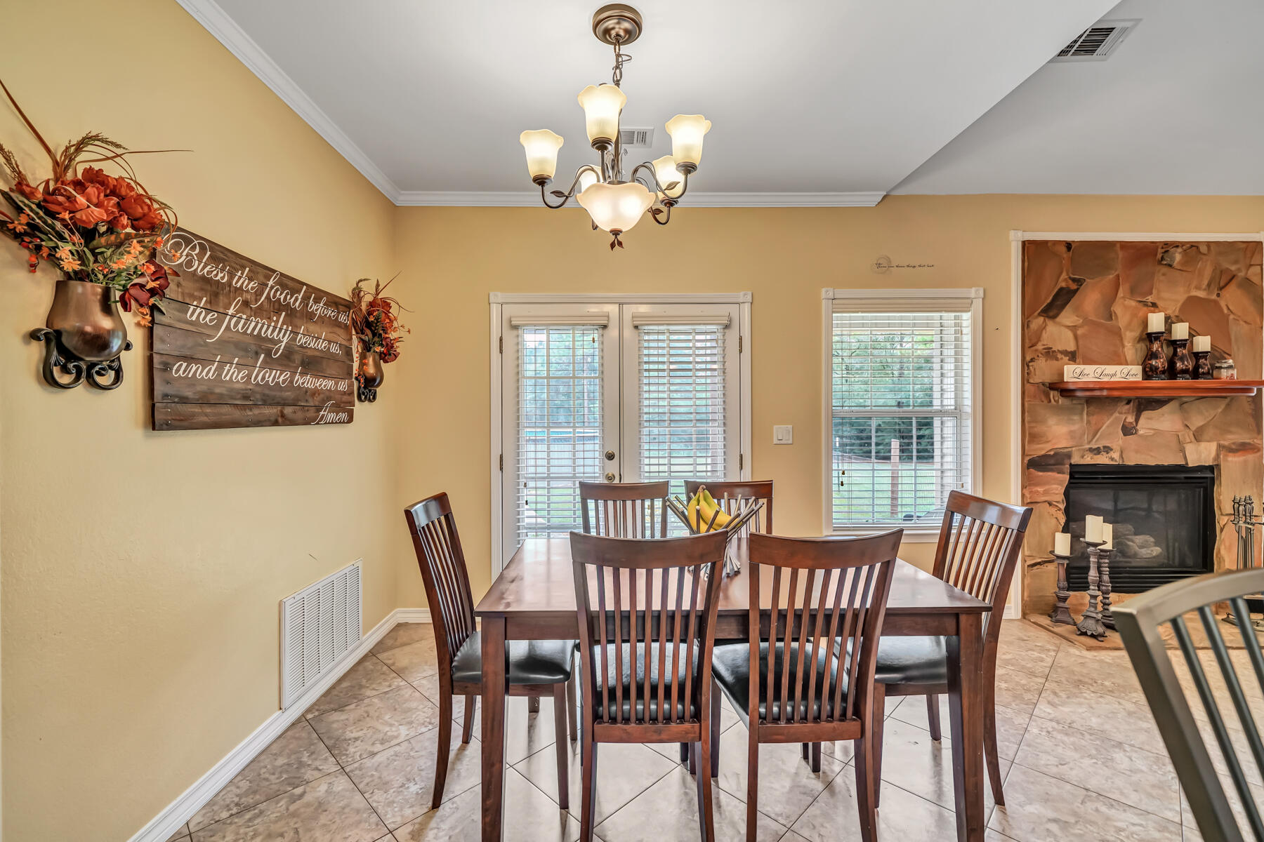 695 7 Oaks Road DeFuniak Springs, FL 32433 - Photo 8 of 47 a view of a dining room with furniture a chandelier and wooden floor