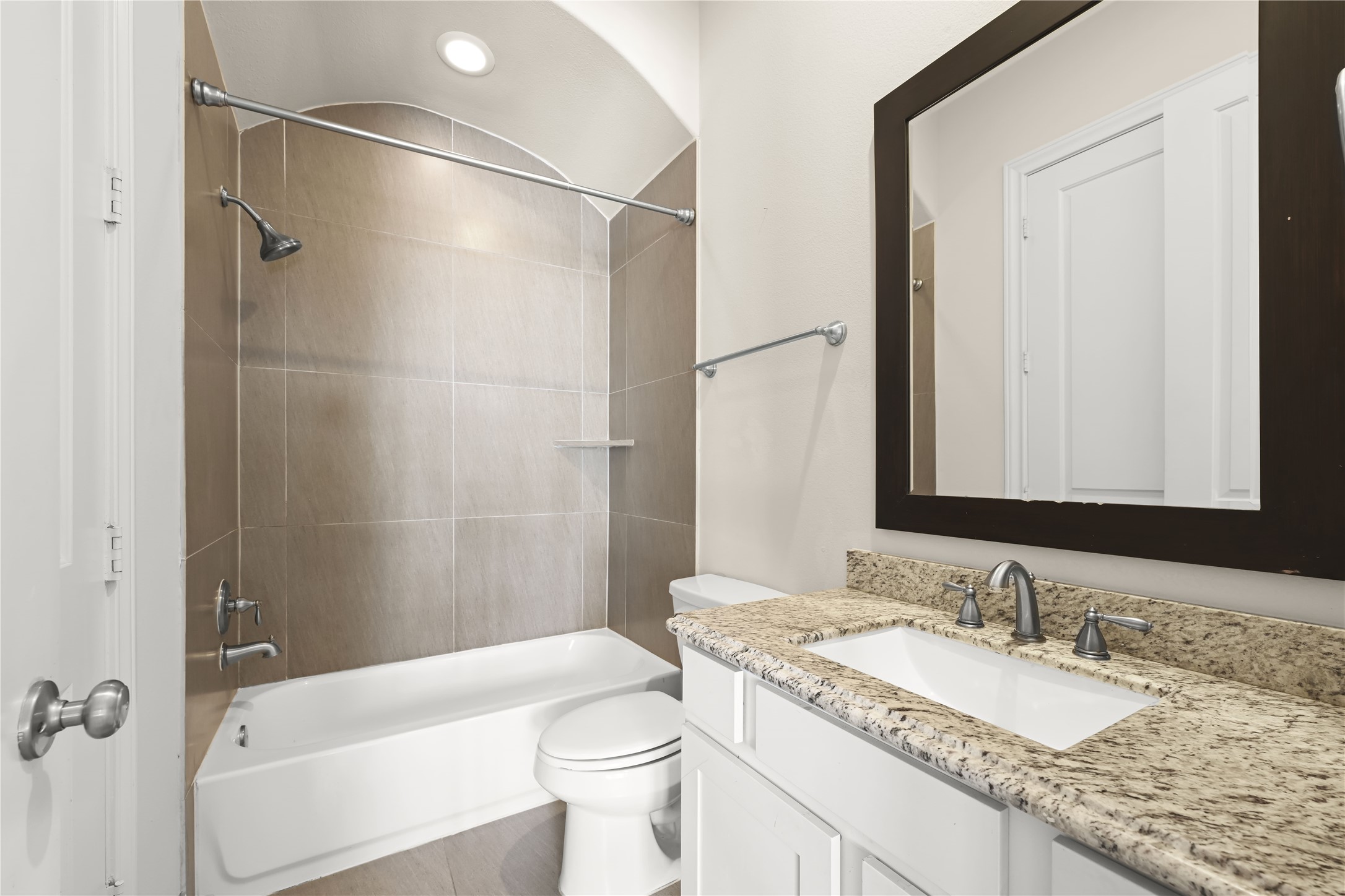1027 St Charles Street Houston, TX 77003 - Photo 18 of 23 a bathroom with a granite countertop sink toilet and shower