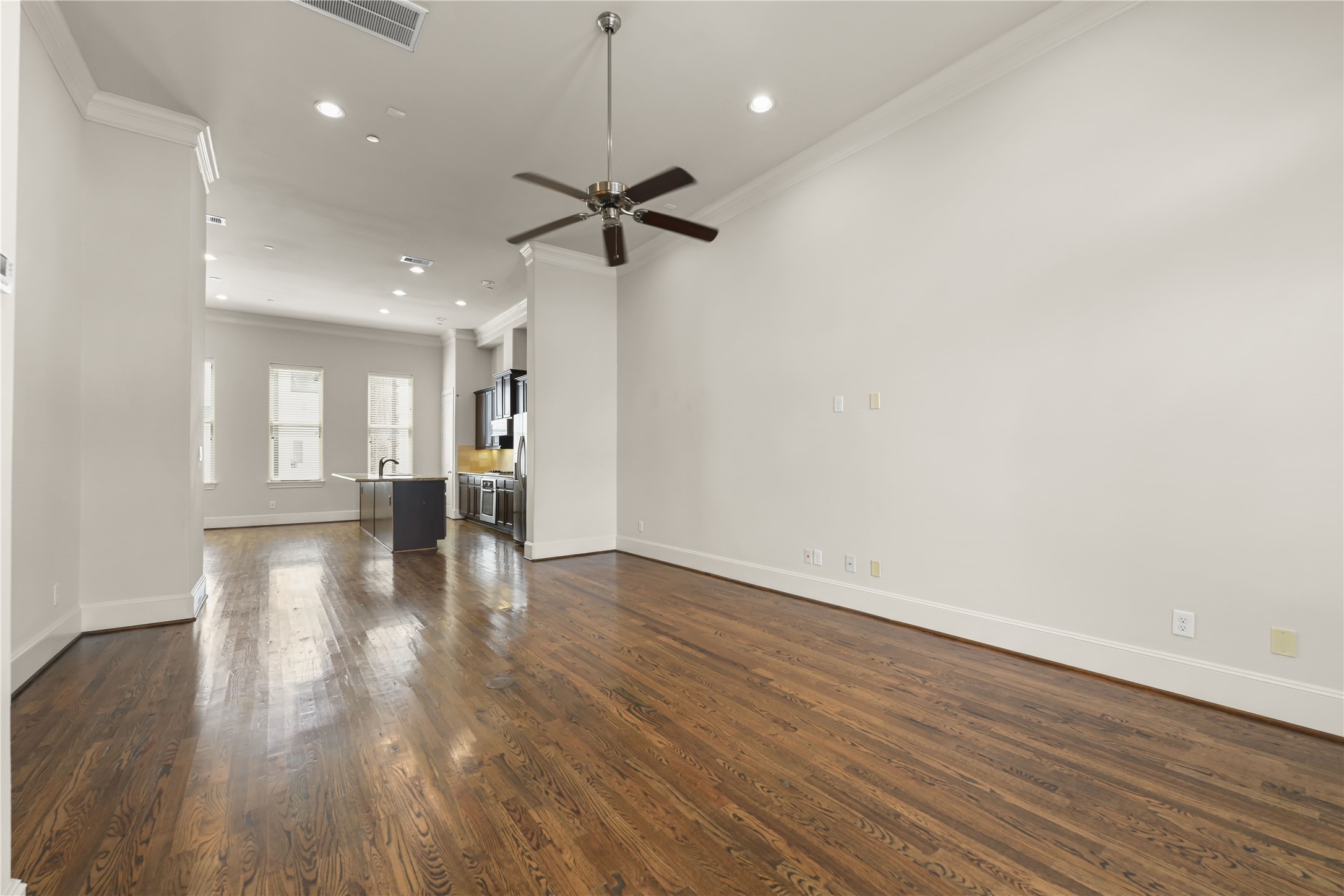 1027 St Charles Street Houston, TX 77003 - Photo 5 of 23 a view of empty room with wooden floor