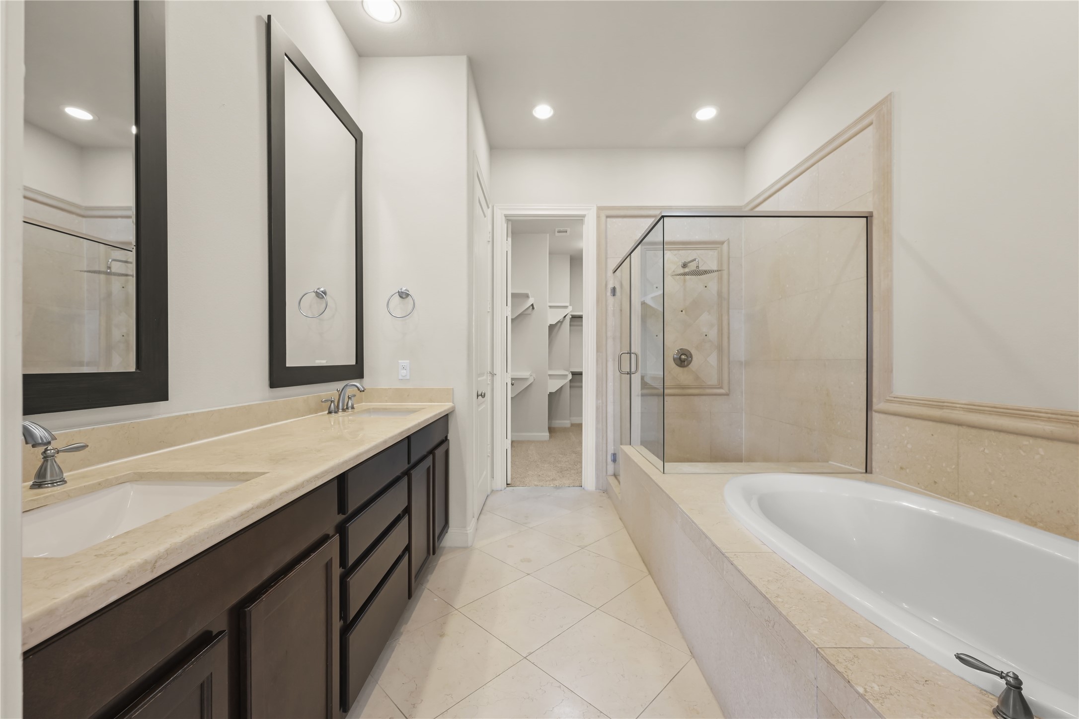 1027 St Charles Street Houston, TX 77003 - Photo 8 of 23 a spacious bathroom with a granite countertop tub sink shower and mirror