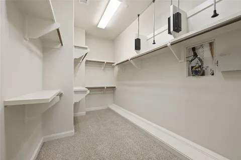 a bathroom with a granite countertop sink a toilet and shower