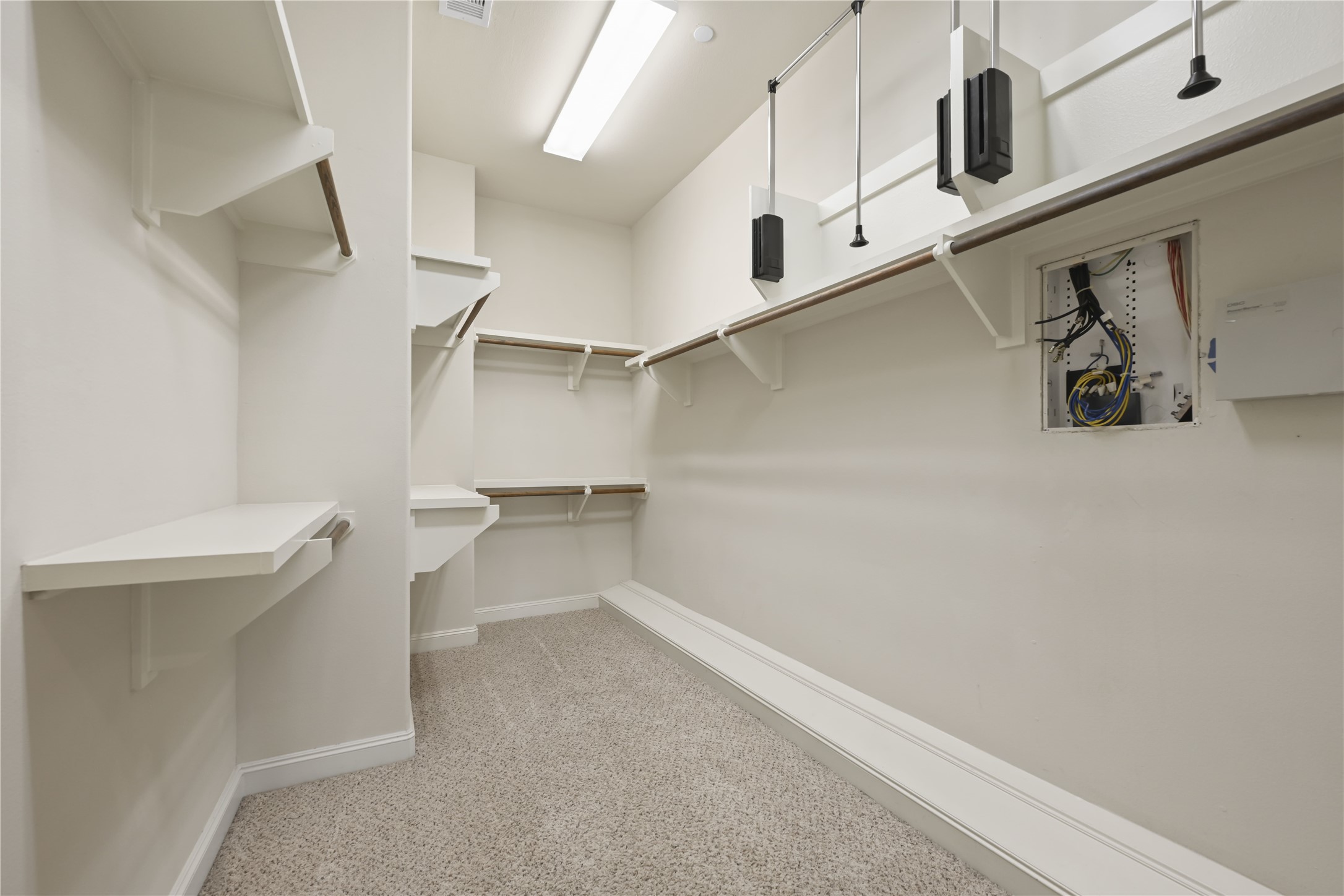 1027 St Charles Street Houston, TX 77003 - Photo 10 of 23 a view of a room with racks on the wall