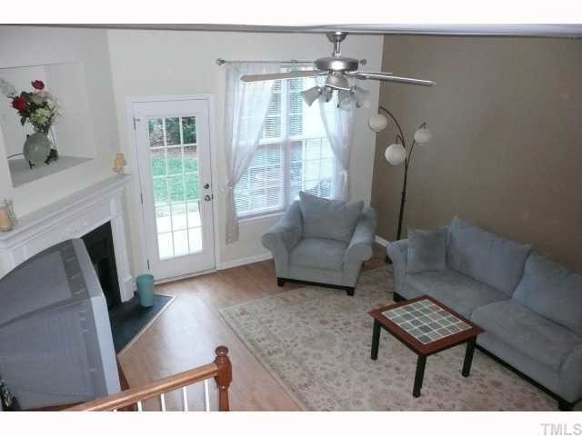 4355 Sugarbend Way Raleigh, NC 27606 - Photo 4 of 12 Spacious living room w/ view of your private patio. Window treatments convey.