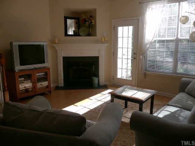 4355 Sugarbend Way Raleigh, NC 27606 - Photo 6 of 12 Cozy corner gas fireplace w/ TV niche above.
