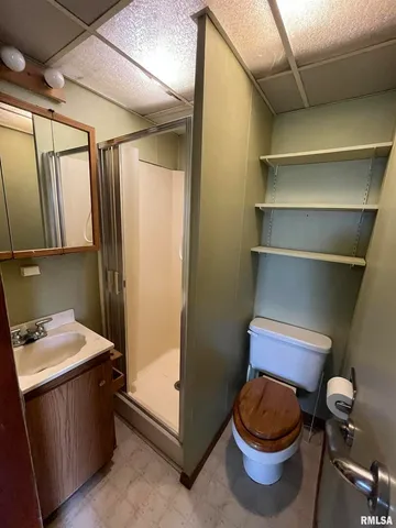 a kitchen with granite countertop a sink stove and cabinets