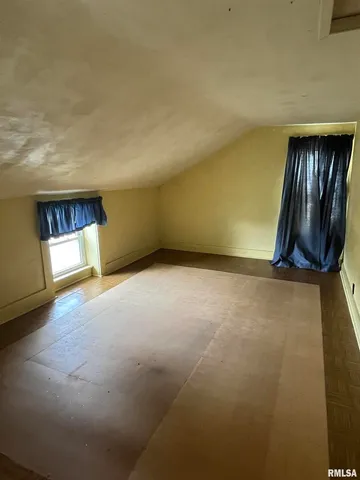 a bathroom with a shower and a toilet