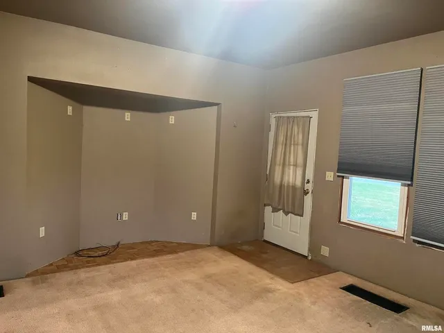 a view of empty room with front door