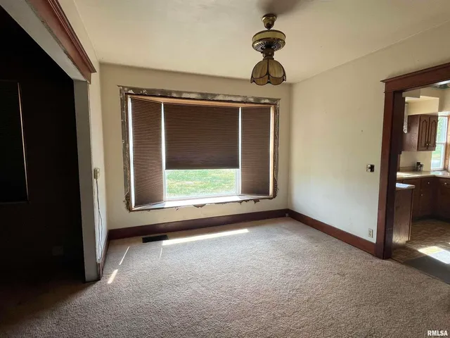 a view of a hallway view with staircase