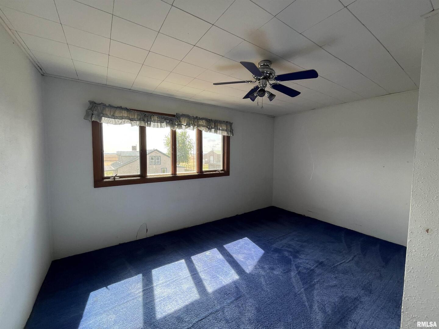 2283 East 2750th Street Kewanee, IL 61443 - Photo 52 of 58 an empty room with windows and fan