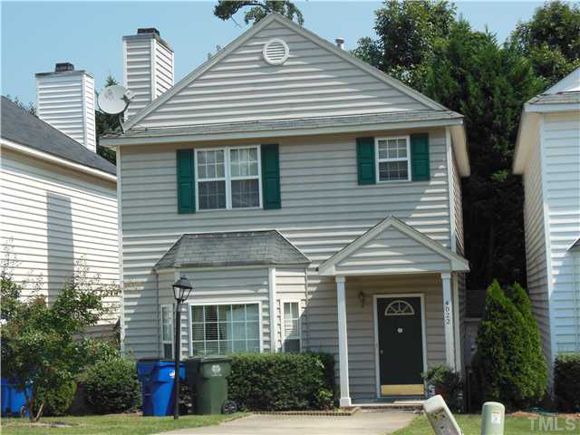 4022 Beaufain Street Raleigh, NC 27604 - Photo 1 of 6 a front view of a house with a yard