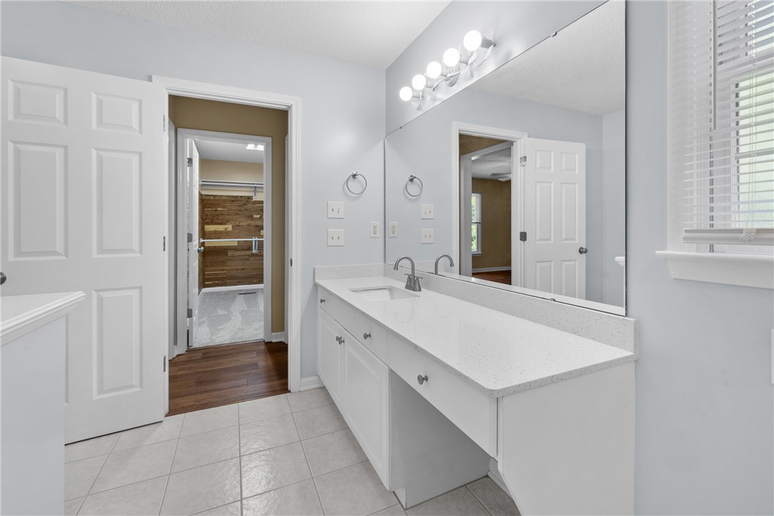 429 Burns Mill Road West Union, SC 29696 - Photo 23 of 49 A well-appointed bathroom features a single vanity with ample counter space and a large mirror.