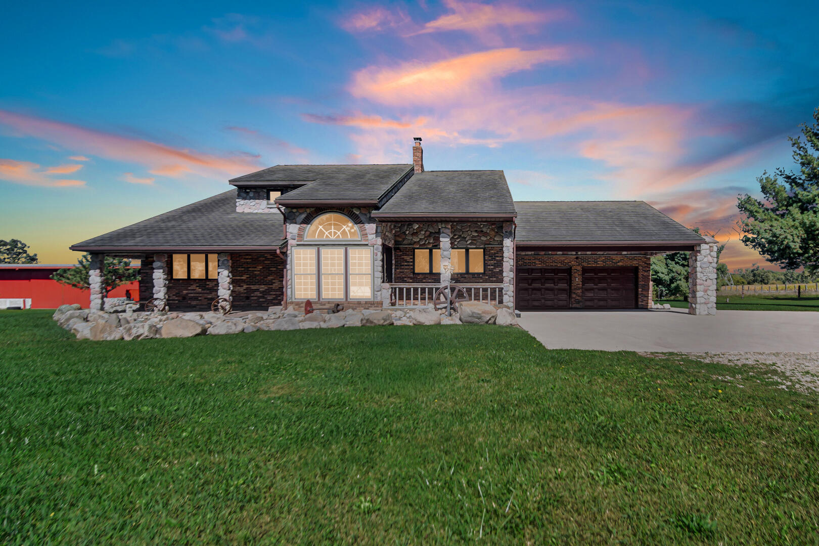 a front view of a house with a garden and plants