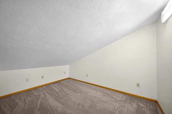 a bedroom with furniture and window