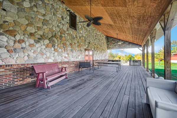 a view of a patio with wooden floor
