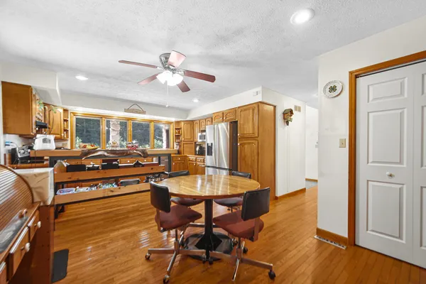 a very nice looking living room with dining room and wooden floor
