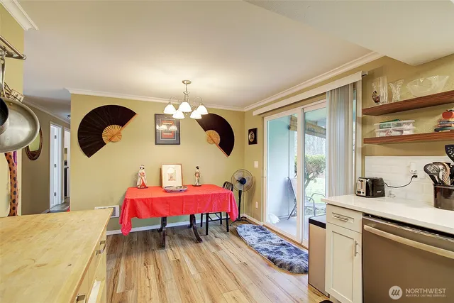 a bedroom with a bed dresser and window