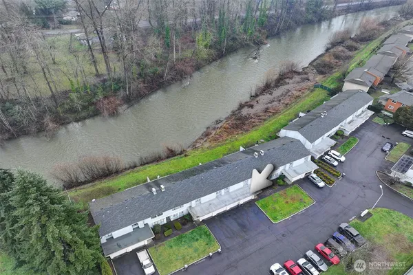an aerial view of a house with a yard