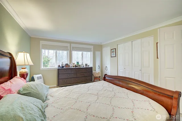 a bed room with a bed and a window