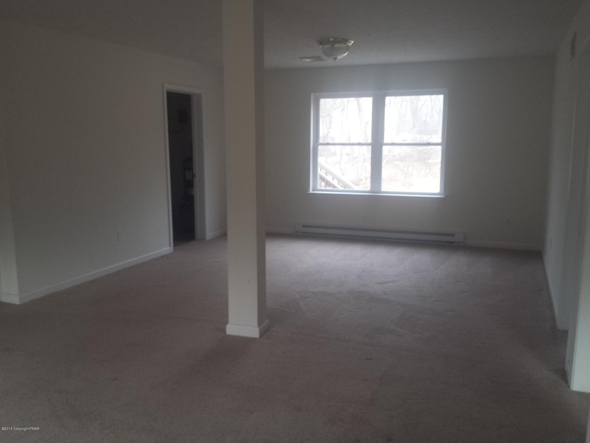 276 Powder Horn Road Henryville, PA 18332 - Photo 11 of 16 an empty room that has a window