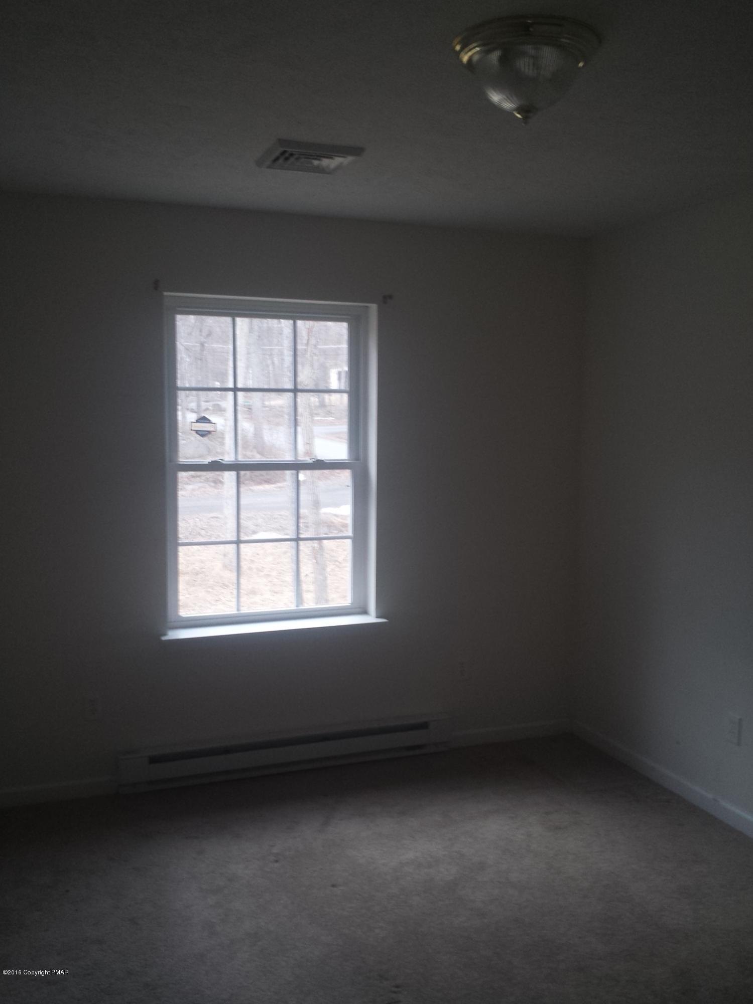 276 Powder Horn Road Henryville, PA 18332 - Photo 13 of 16 an empty room with a window