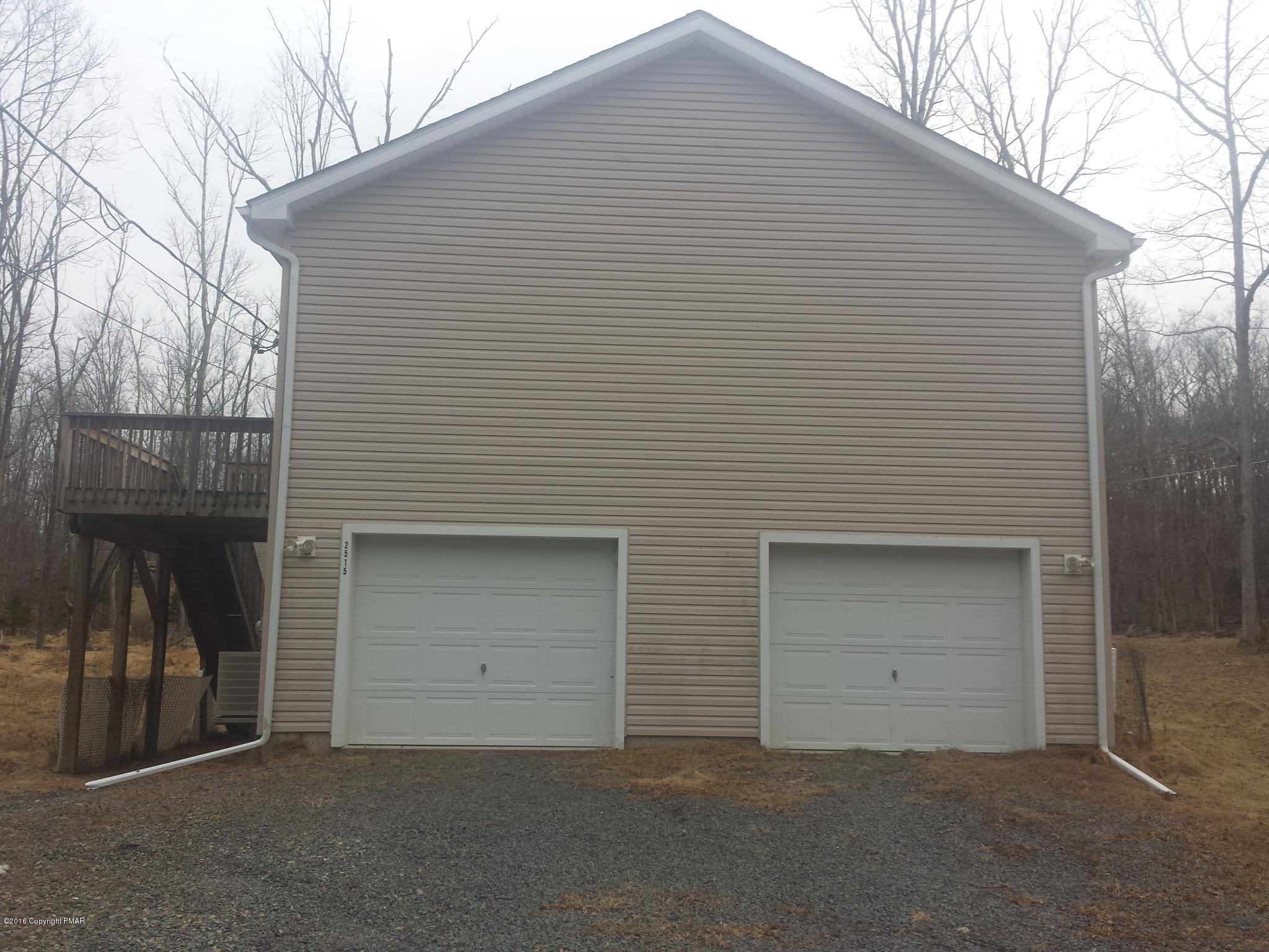276 Powder Horn Road Henryville, PA 18332 - Photo 14 of 16 a front view of a house with garage