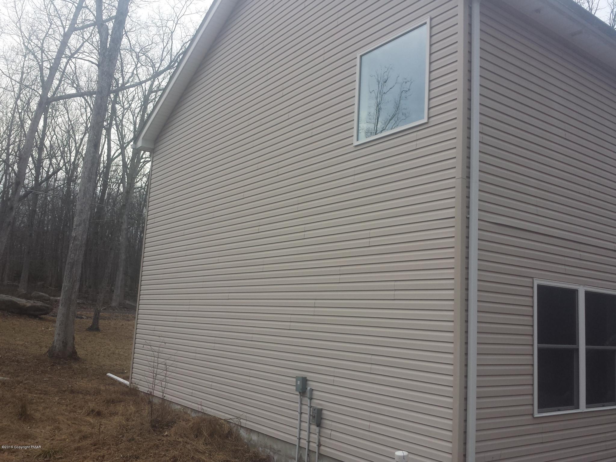 276 Powder Horn Road Henryville, PA 18332 - Photo 16 of 16 a view of a house with a white wall