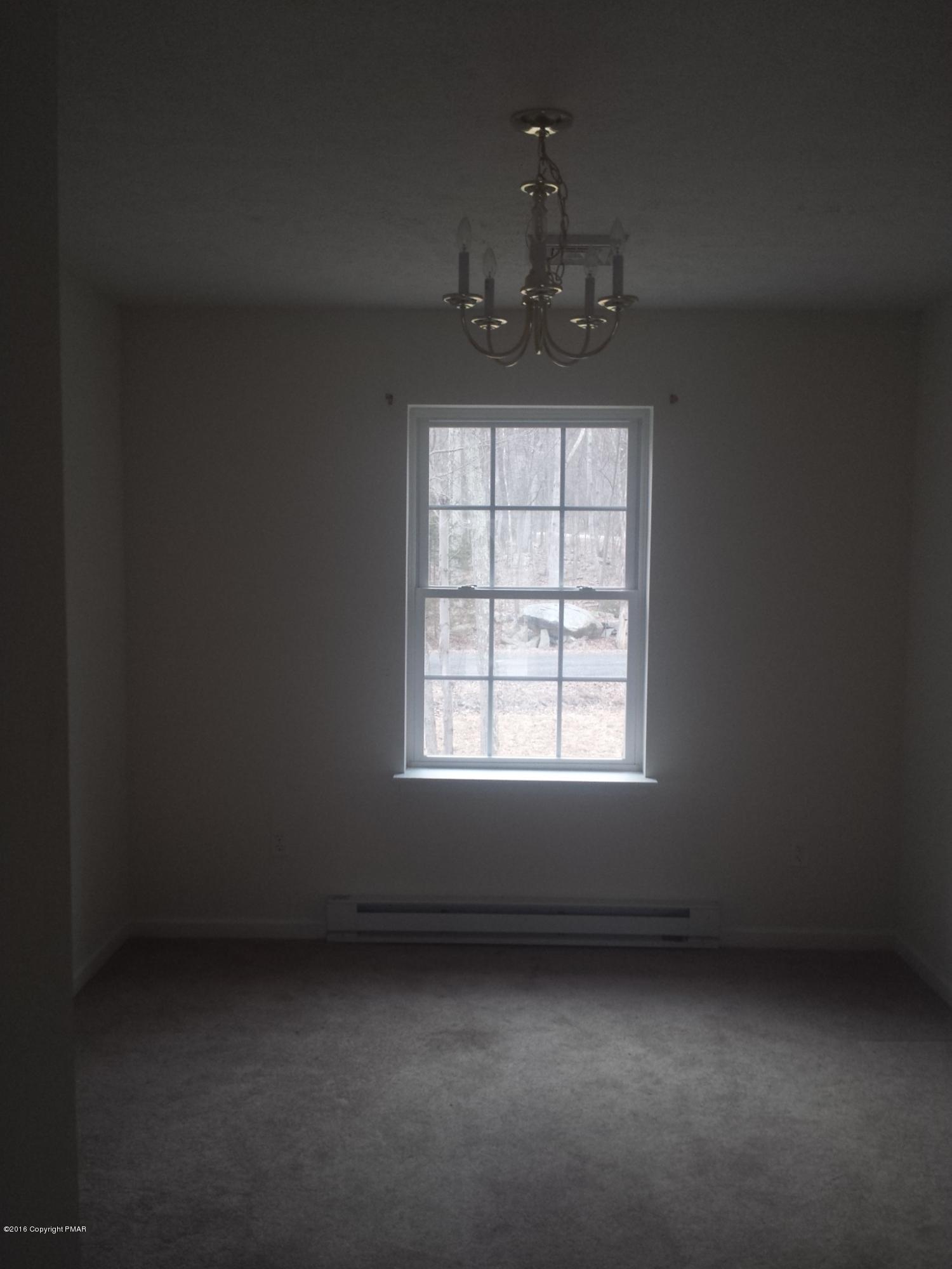 276 Powder Horn Road Henryville, PA 18332 - Photo 5 of 16 an empty room with a window