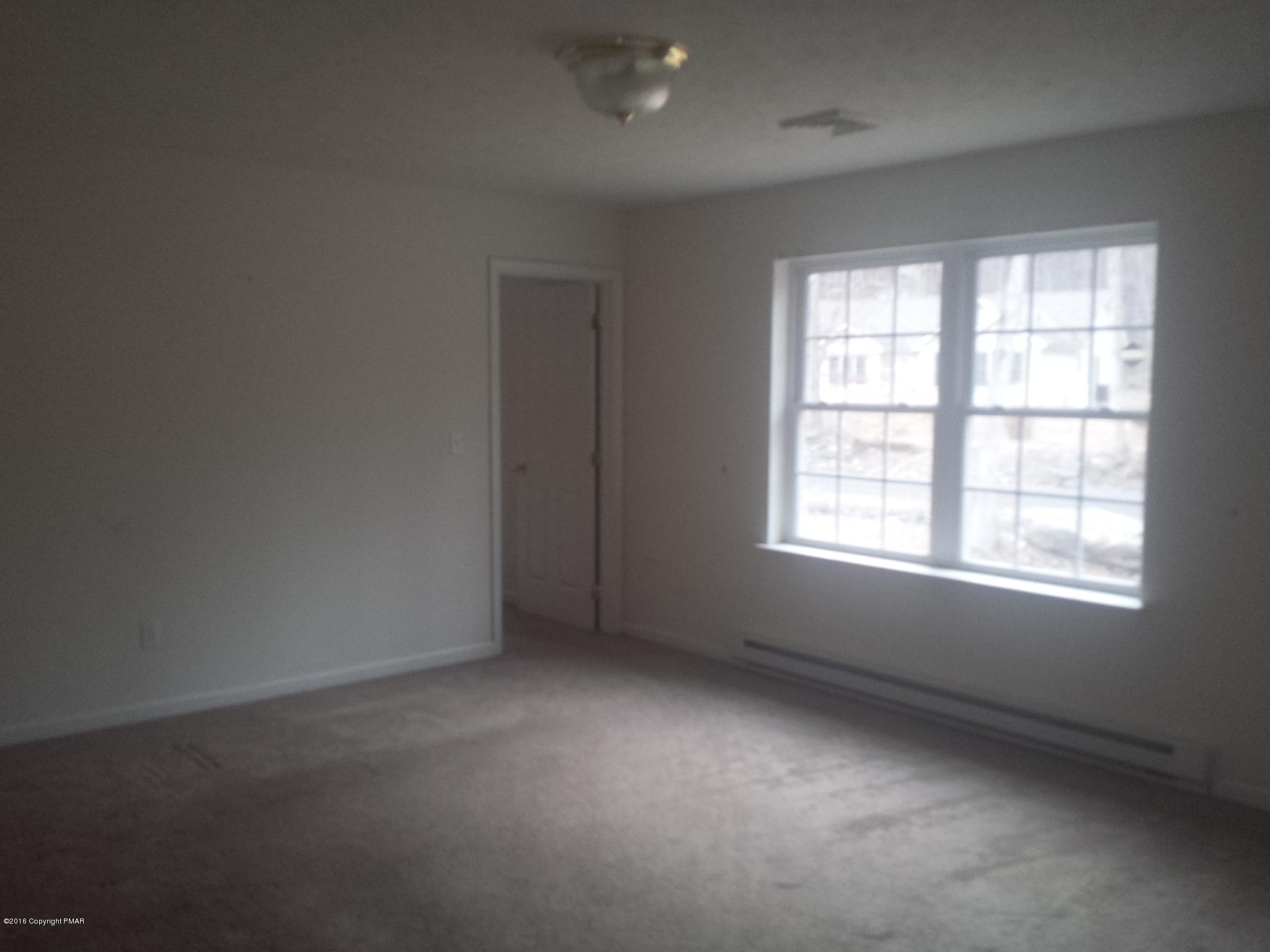 276 Powder Horn Road Henryville, PA 18332 - Photo 6 of 16 an empty room with a window