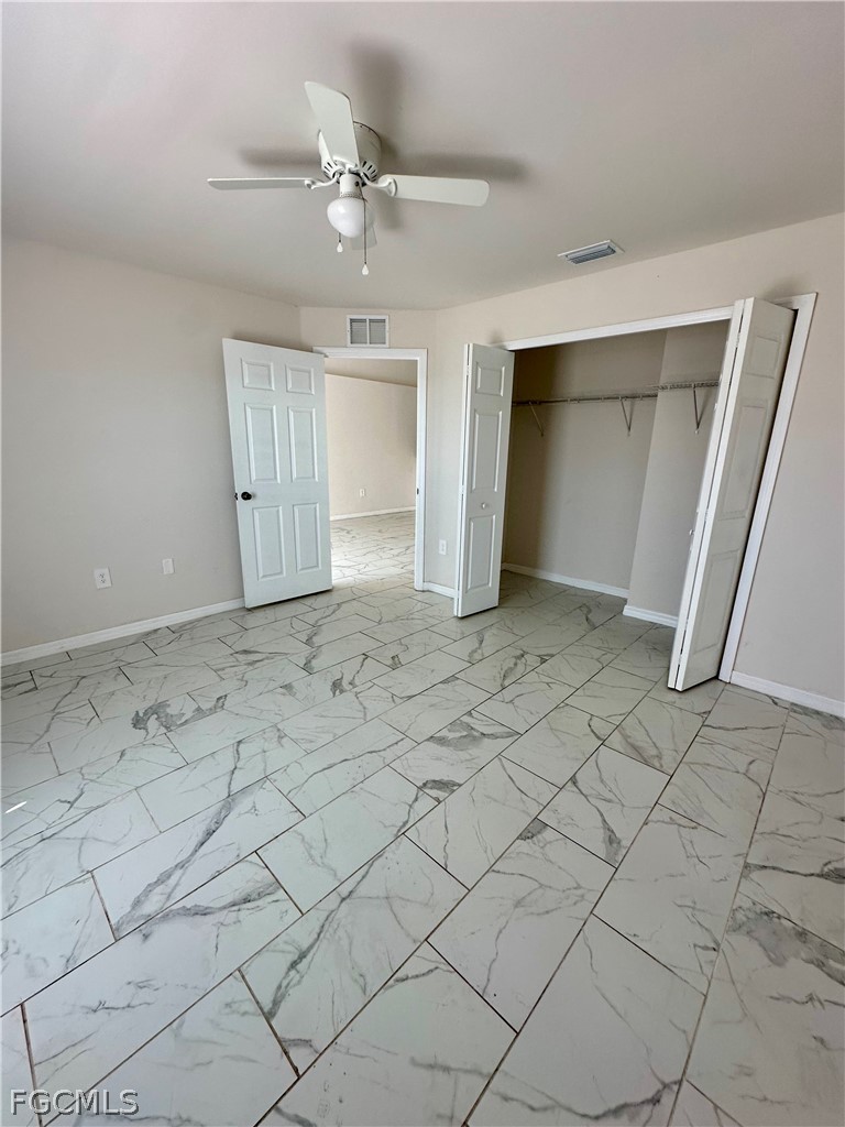 252 Southwest 3rd Street Cape Coral, FL 33991 - Photo 12 of 16 an empty room with white walls and tiles