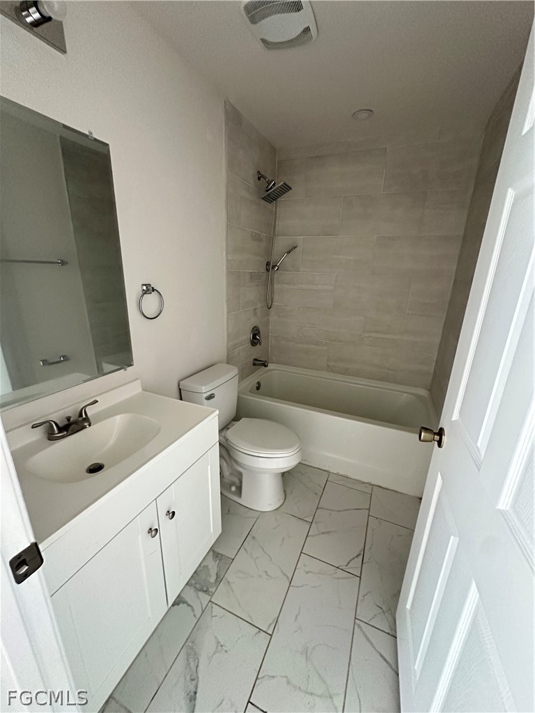252 Southwest 3rd Street Cape Coral, FL 33991 - Photo 14 of 16 a bathroom with a double vanity sink toilet and shower
