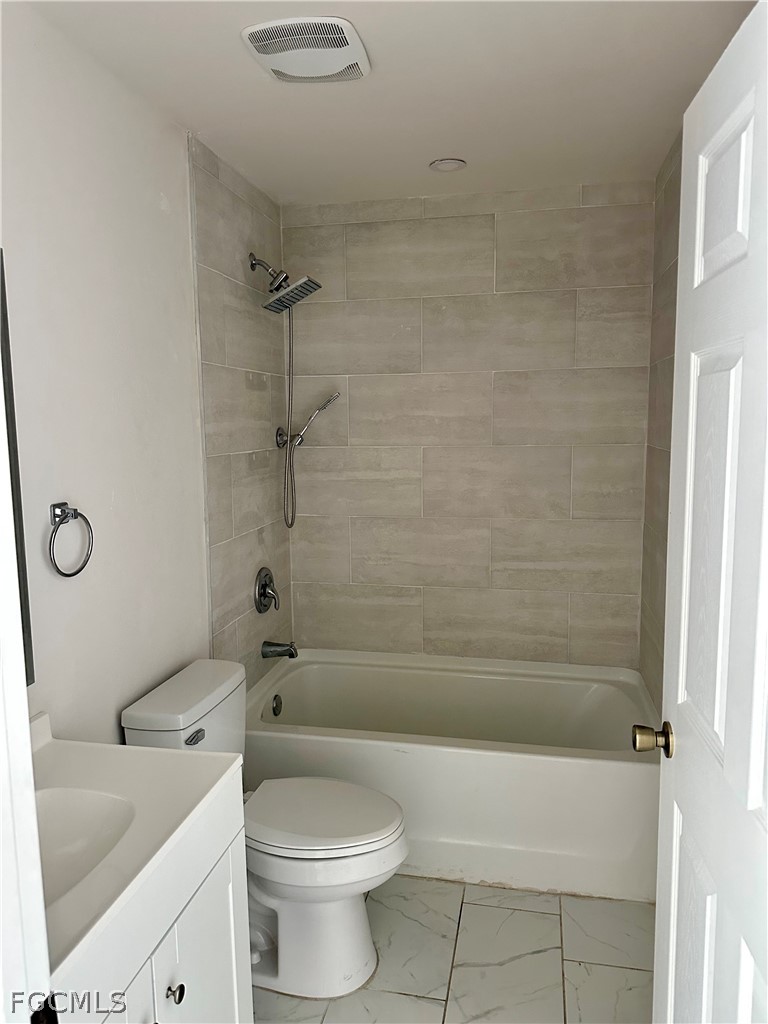 252 Southwest 3rd Street Cape Coral, FL 33991 - Photo 15 of 16 a bathroom with a toilet sink and shower