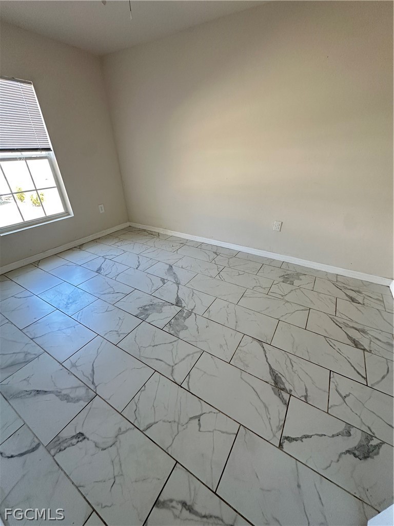 252 Southwest 3rd Street Cape Coral, FL 33991 - Photo 8 of 16 an empty room with windows