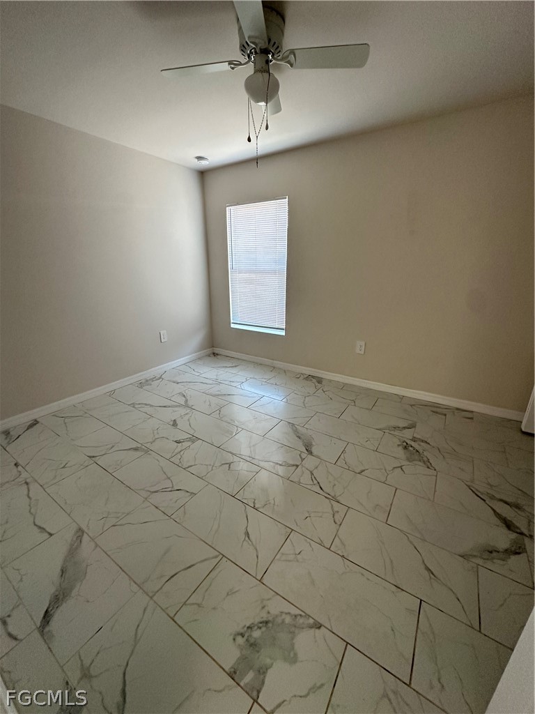 252 Southwest 3rd Street Cape Coral, FL 33991 - Photo 9 of 16 an empty room with windows