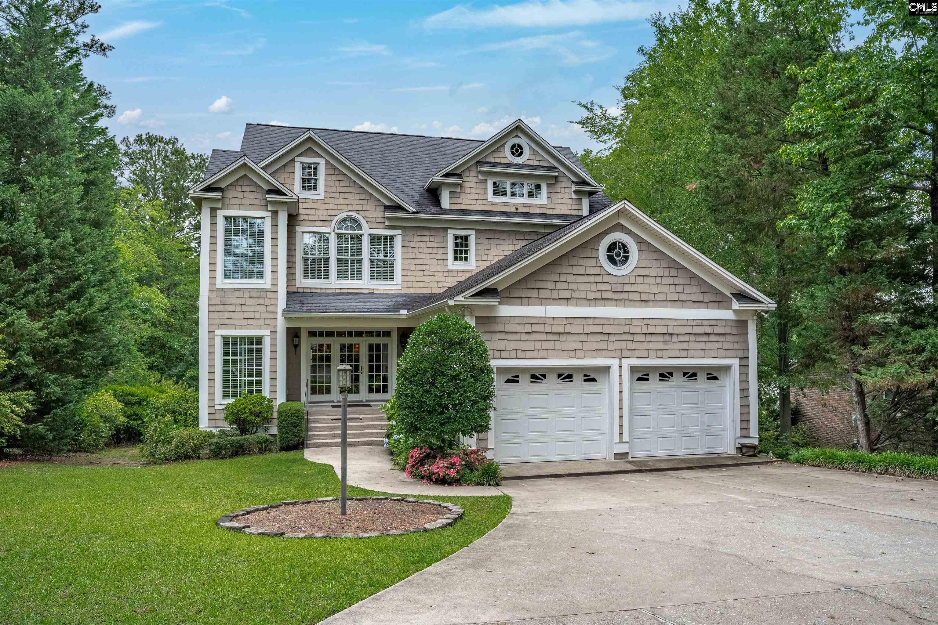 1101 Ellett Road Chapin, SC 29036 - Photo 2 of 24 a front view of a house with a yard and garage