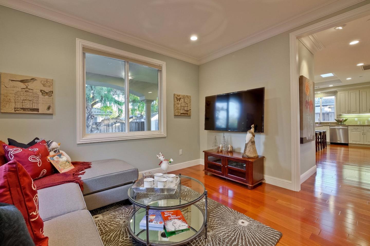 10310 Moretti Drive Cupertino, CA 95014 - Photo 11 of 31 a living room with furniture and a flat screen tv