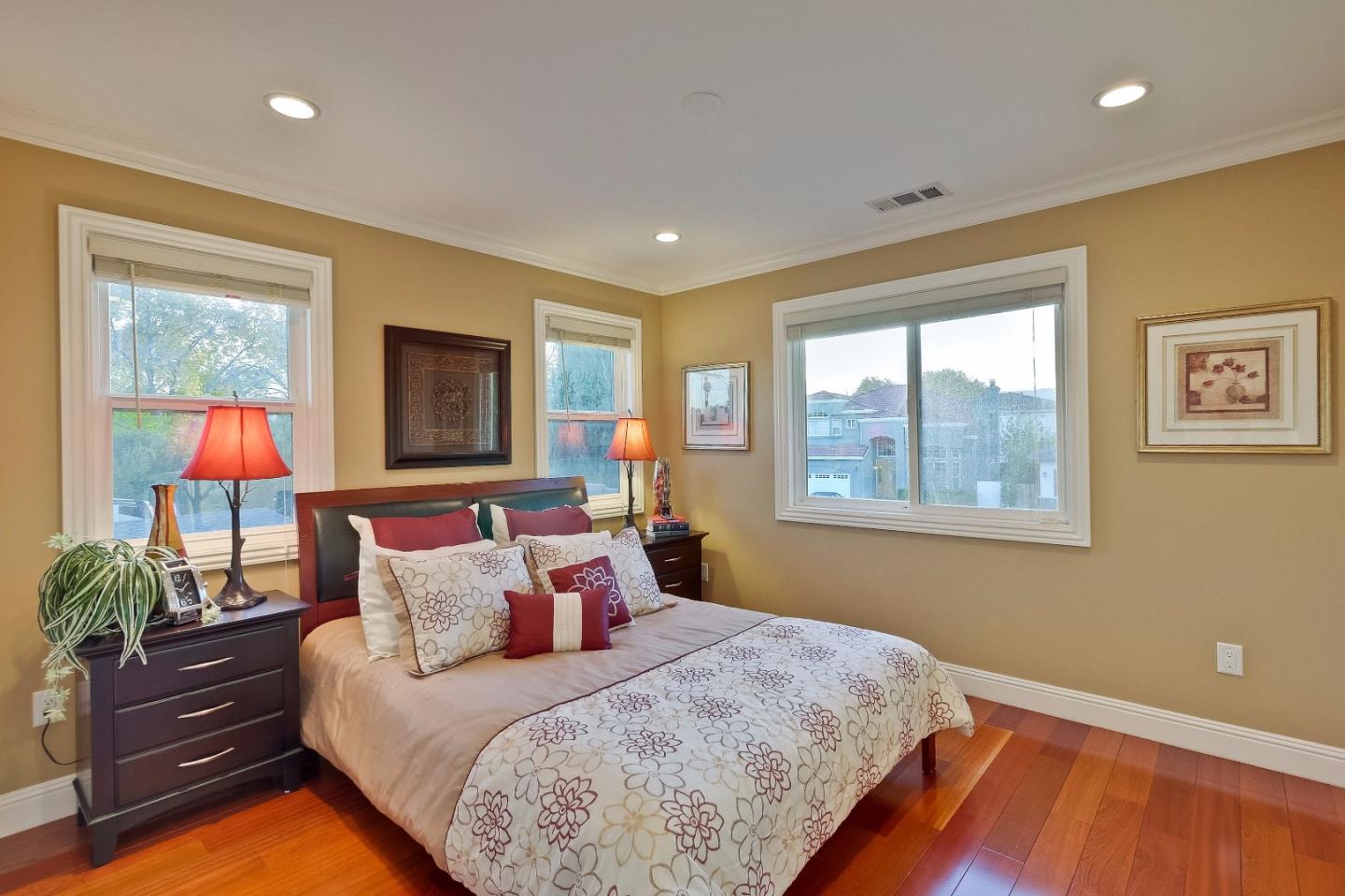 10310 Moretti Drive Cupertino, CA 95014 - Photo 13 of 31 a bedroom with a bed and window