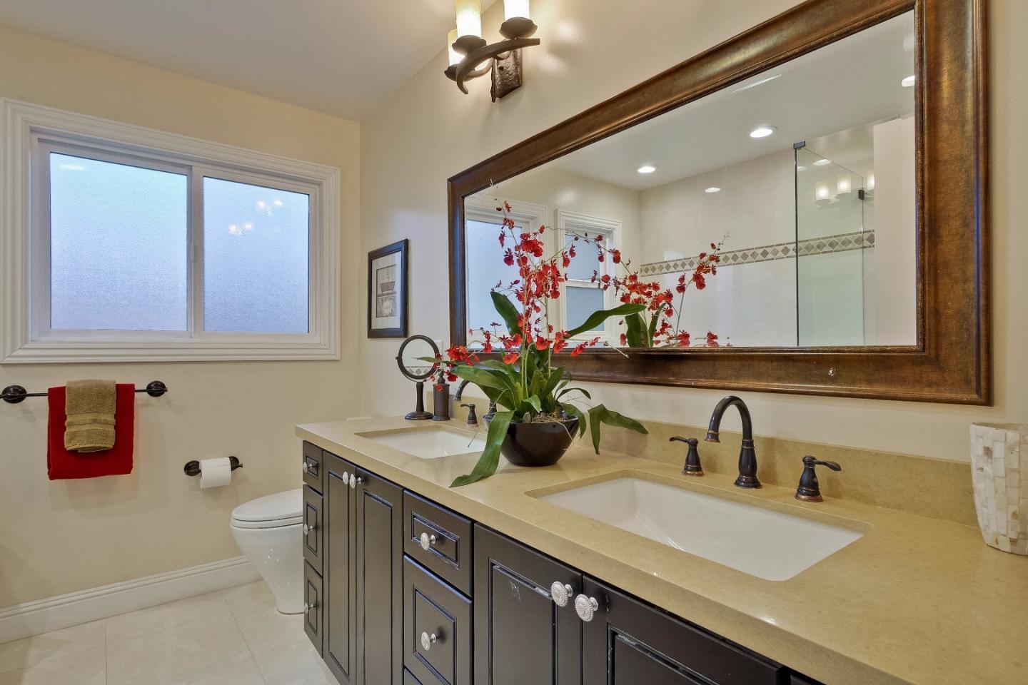 10310 Moretti Drive Cupertino, CA 95014 - Photo 15 of 31 a bathroom with a double vanity sink mirror and double