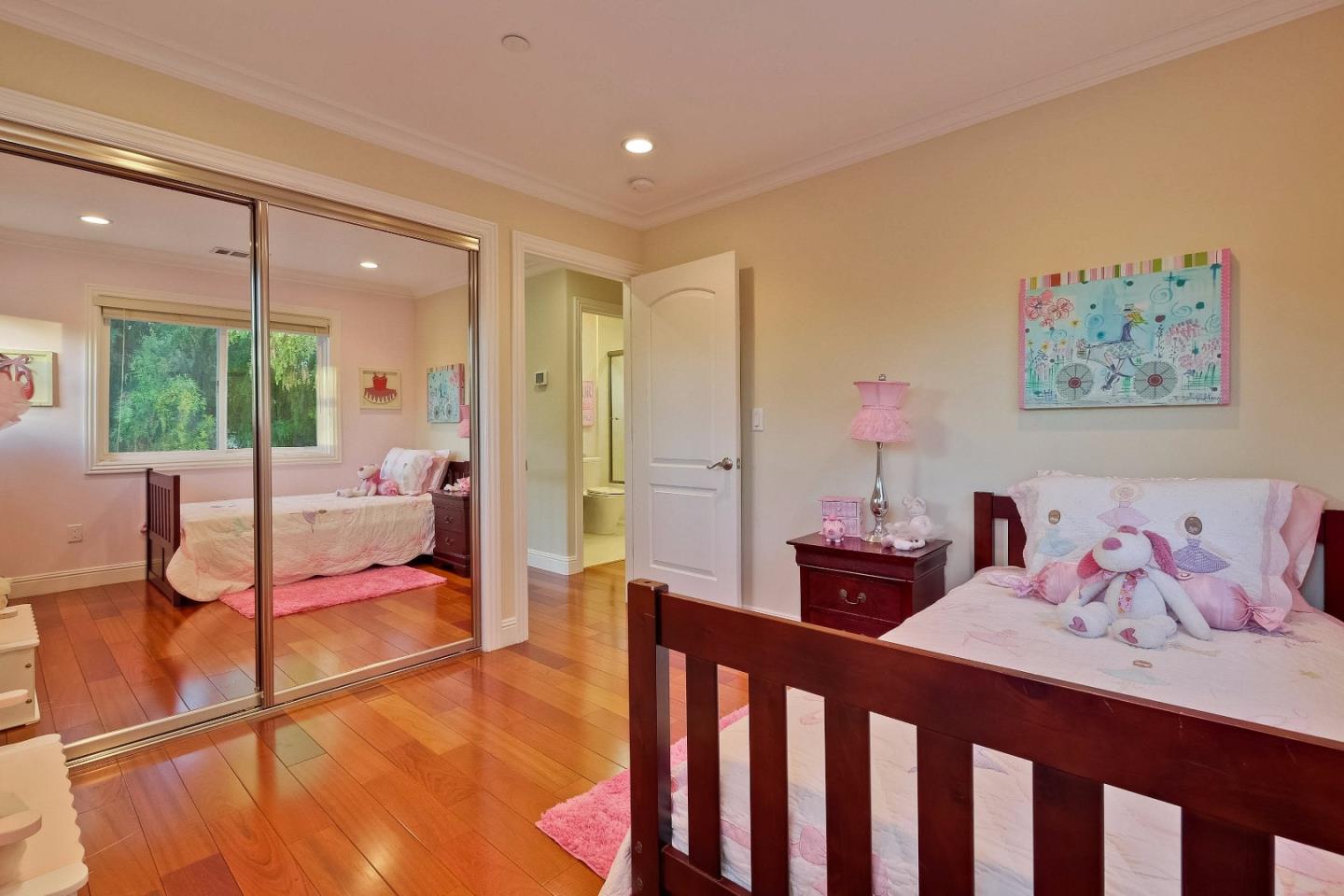 10310 Moretti Drive Cupertino, CA 95014 - Photo 18 of 31 a bedroom with furniture and wooden floor
