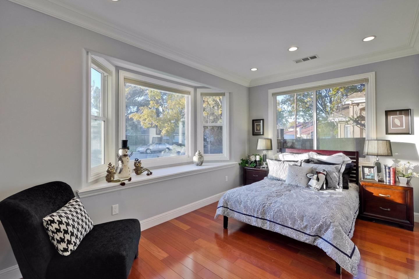 10310 Moretti Drive Cupertino, CA 95014 - Photo 23 of 31 a bedroom with a bed couch and a large window