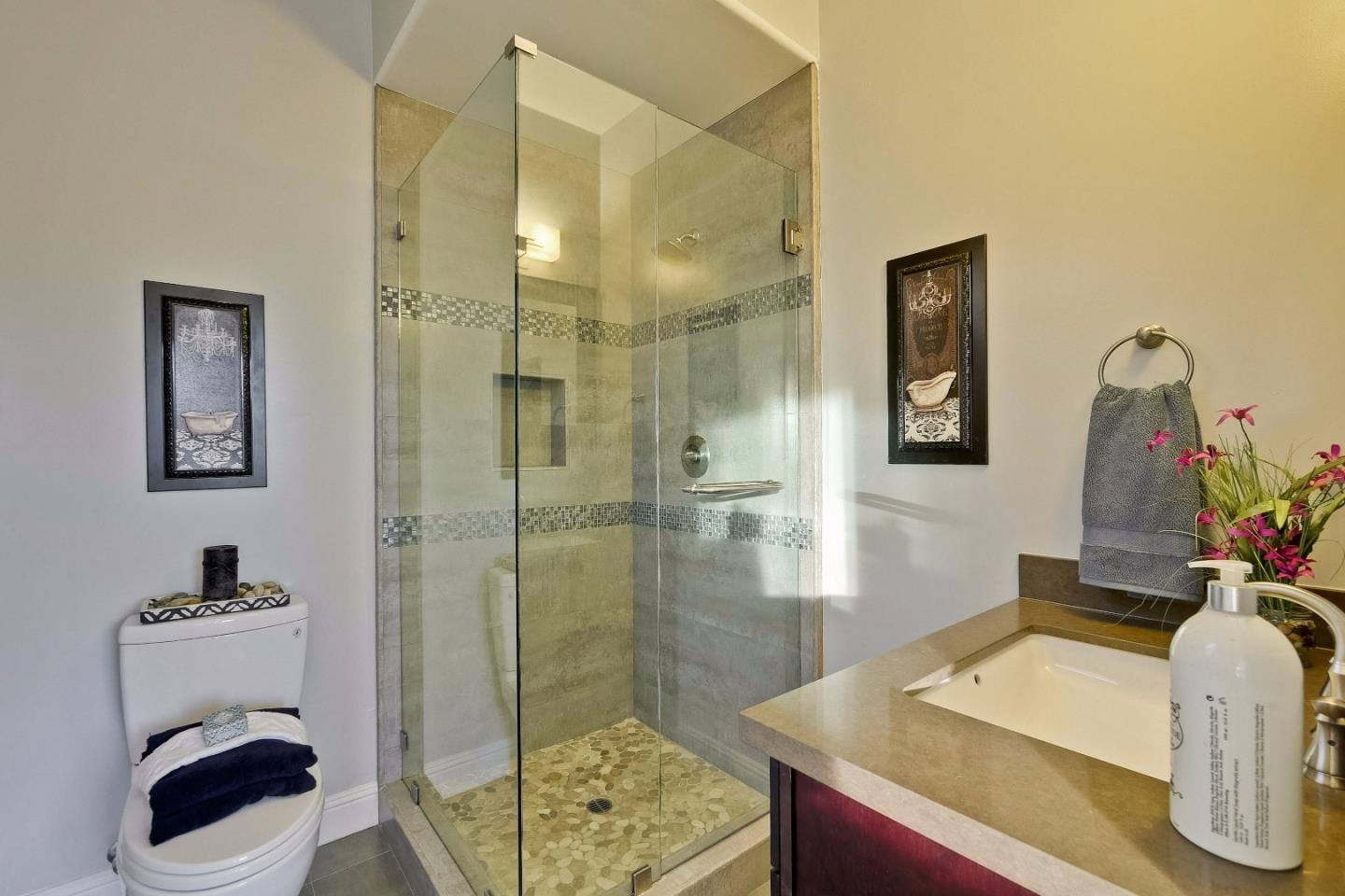 10310 Moretti Drive Cupertino, CA 95014 - Photo 25 of 31 a bathroom with a sink a toilet and shower