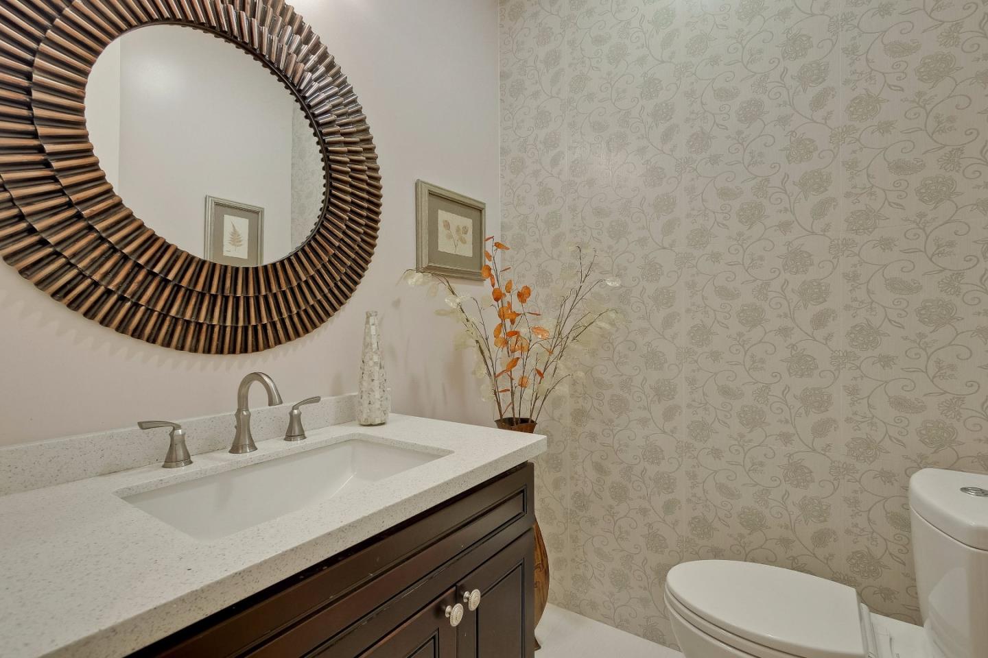 10310 Moretti Drive Cupertino, CA 95014 - Photo 26 of 31 a bathroom with a sink a toilet and a mirror