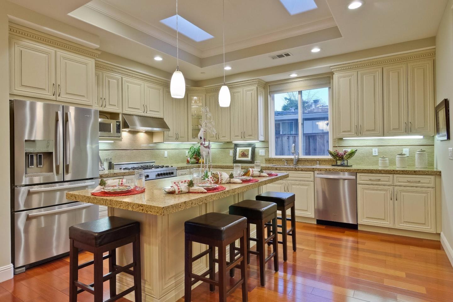 10310 Moretti Drive Cupertino, CA 95014 - Photo 5 of 31 a kitchen with stainless steel appliances stove refrigerator and cabinets