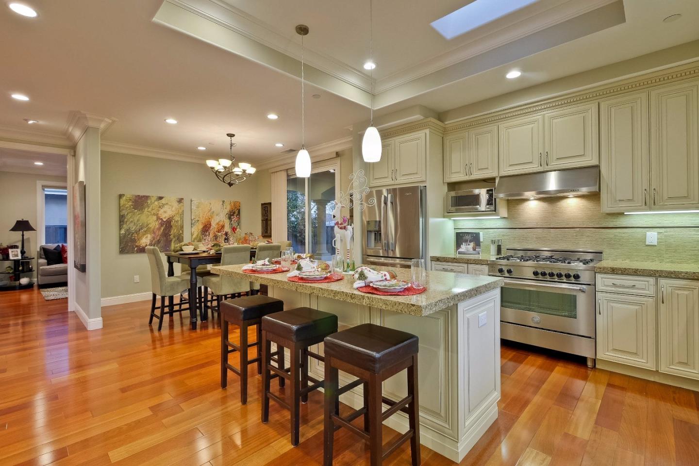 10310 Moretti Drive Cupertino, CA 95014 - Photo 6 of 31 a kitchen with lots of counter top space and stainless steel appliances