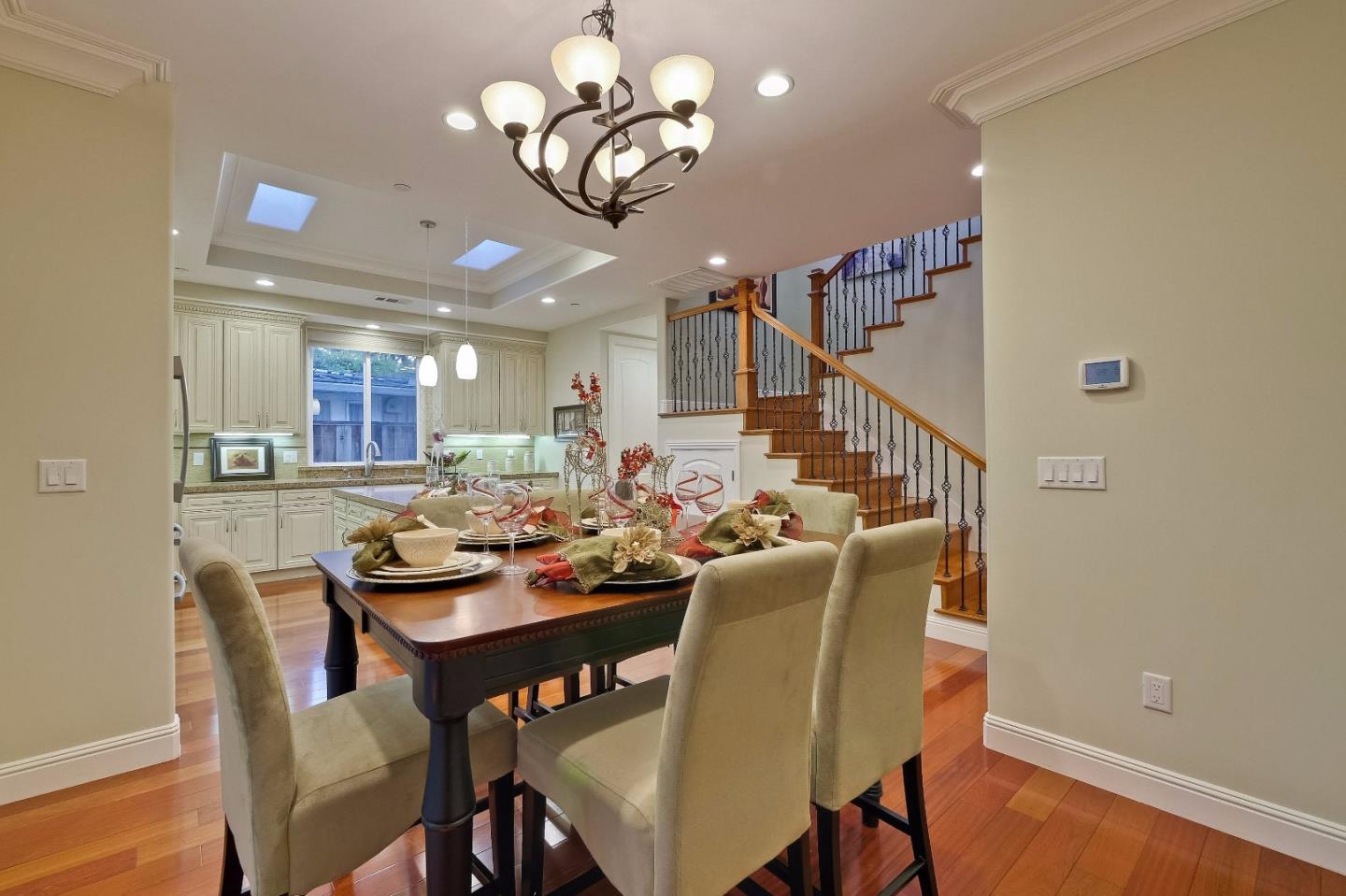 10310 Moretti Drive Cupertino, CA 95014 - Photo 9 of 31 a view of a dining room with furniture and wooden floor