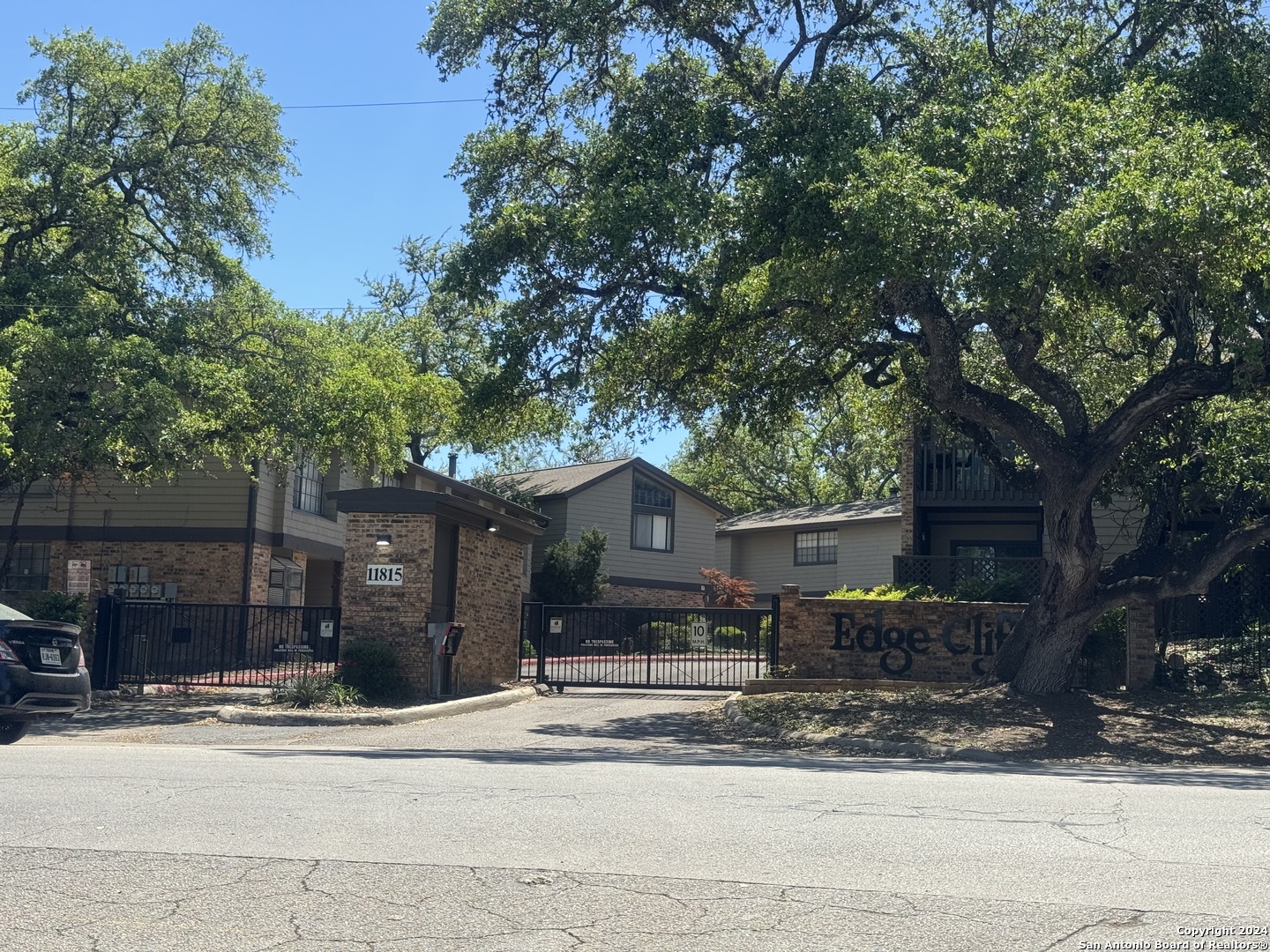 11815 Vance Jackson Road, Unit 3603 San Antonio, TX 78230 - Photo 1 of 1 a front view of a house with a yard and garage