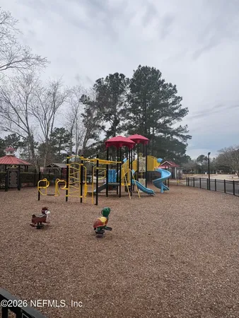 a view of a park with swings and slides