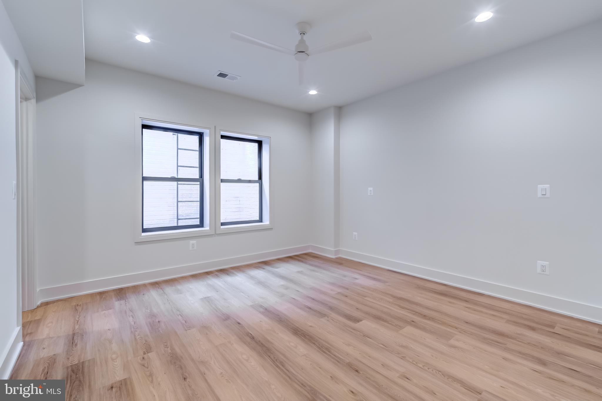 913 Symphony Circle Southwest Vienna, VA 22180 - Photo 106 of 150 wooden floor in an empty room with a window