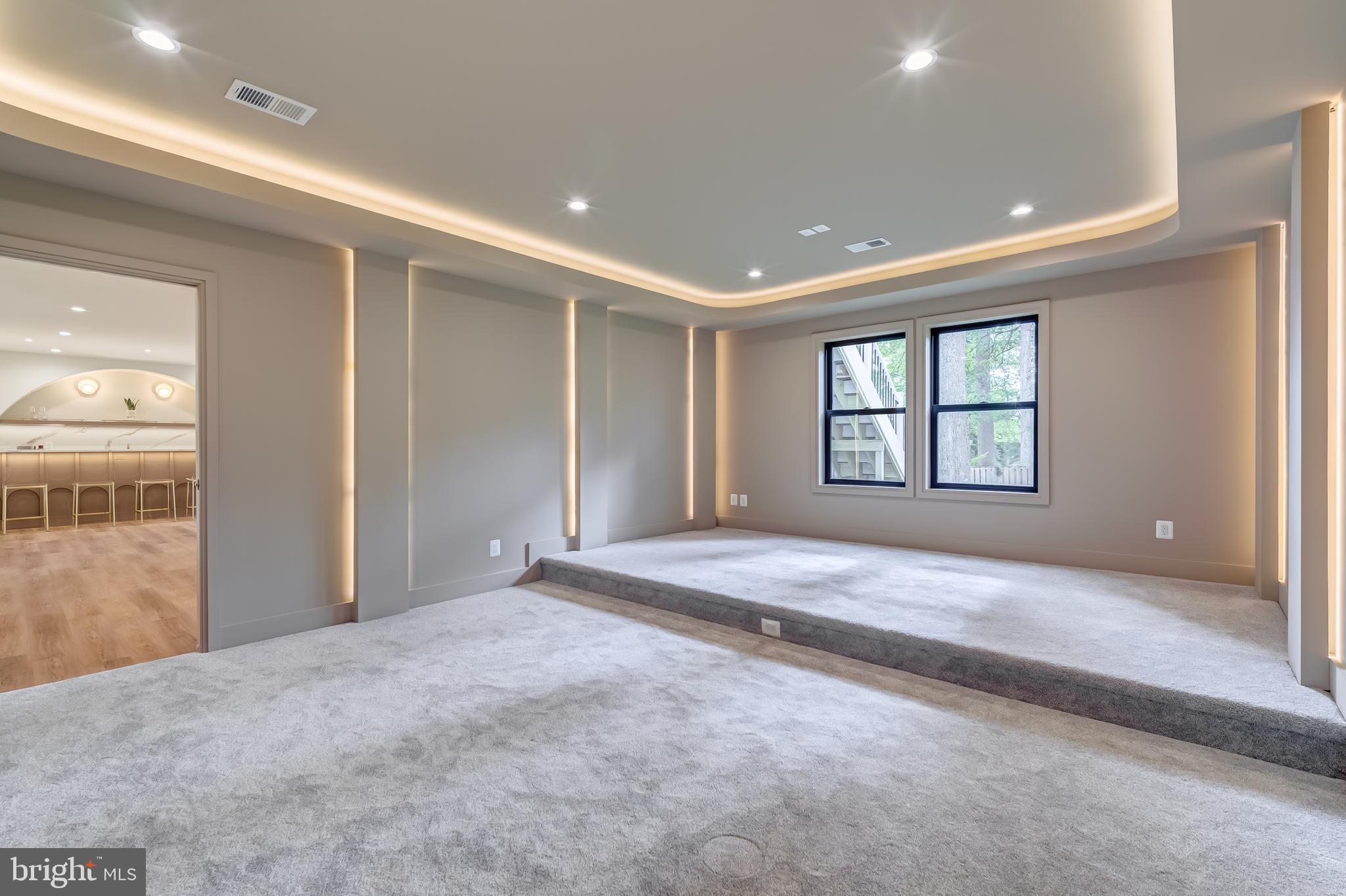 913 Symphony Circle Southwest Vienna, VA 22180 - Photo 112 of 150 a view of an empty room with a window and a kitchen