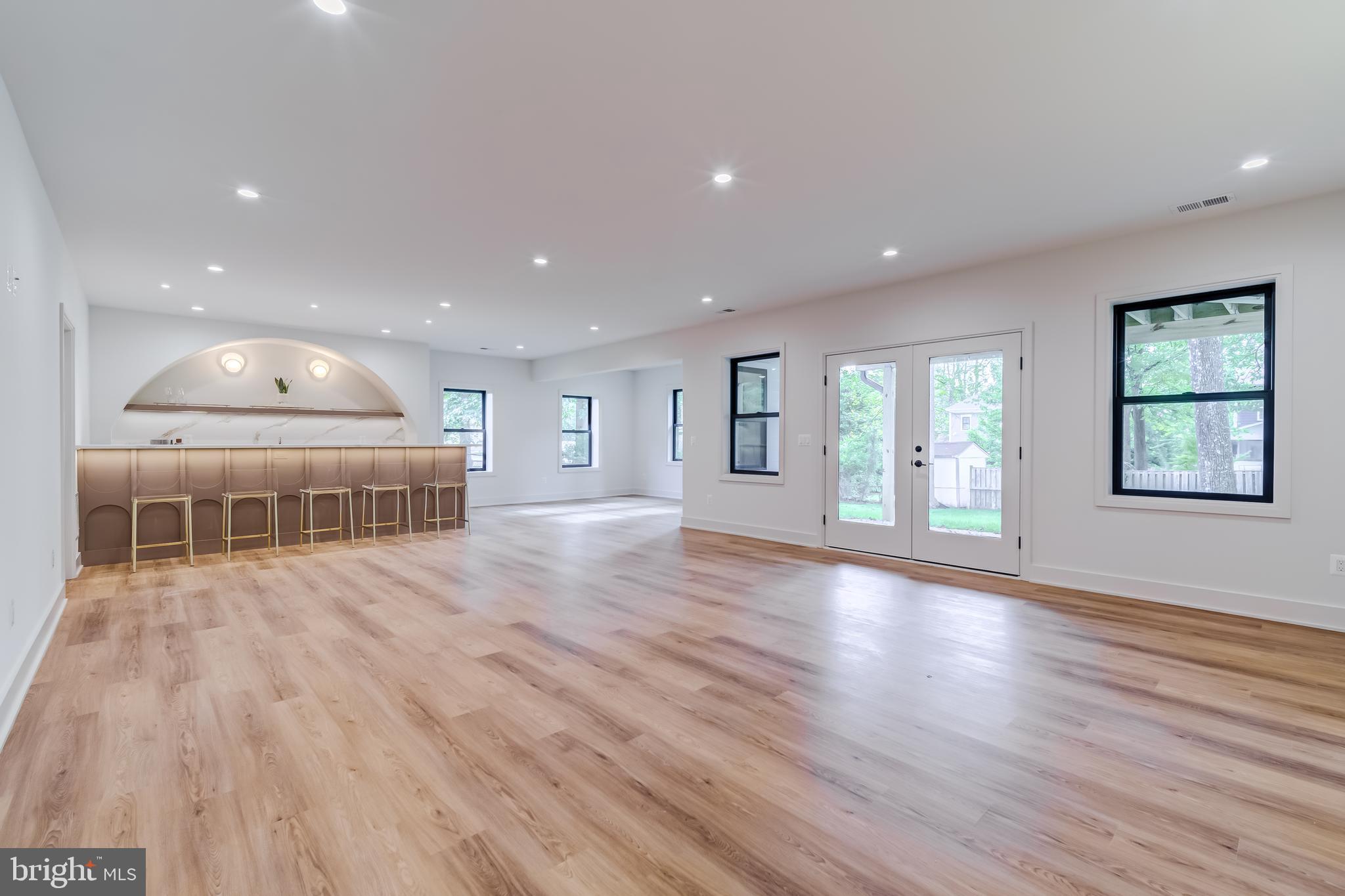 913 Symphony Circle Southwest Vienna, VA 22180 - Photo 116 of 150 a view of an empty room with wooden floor and a window