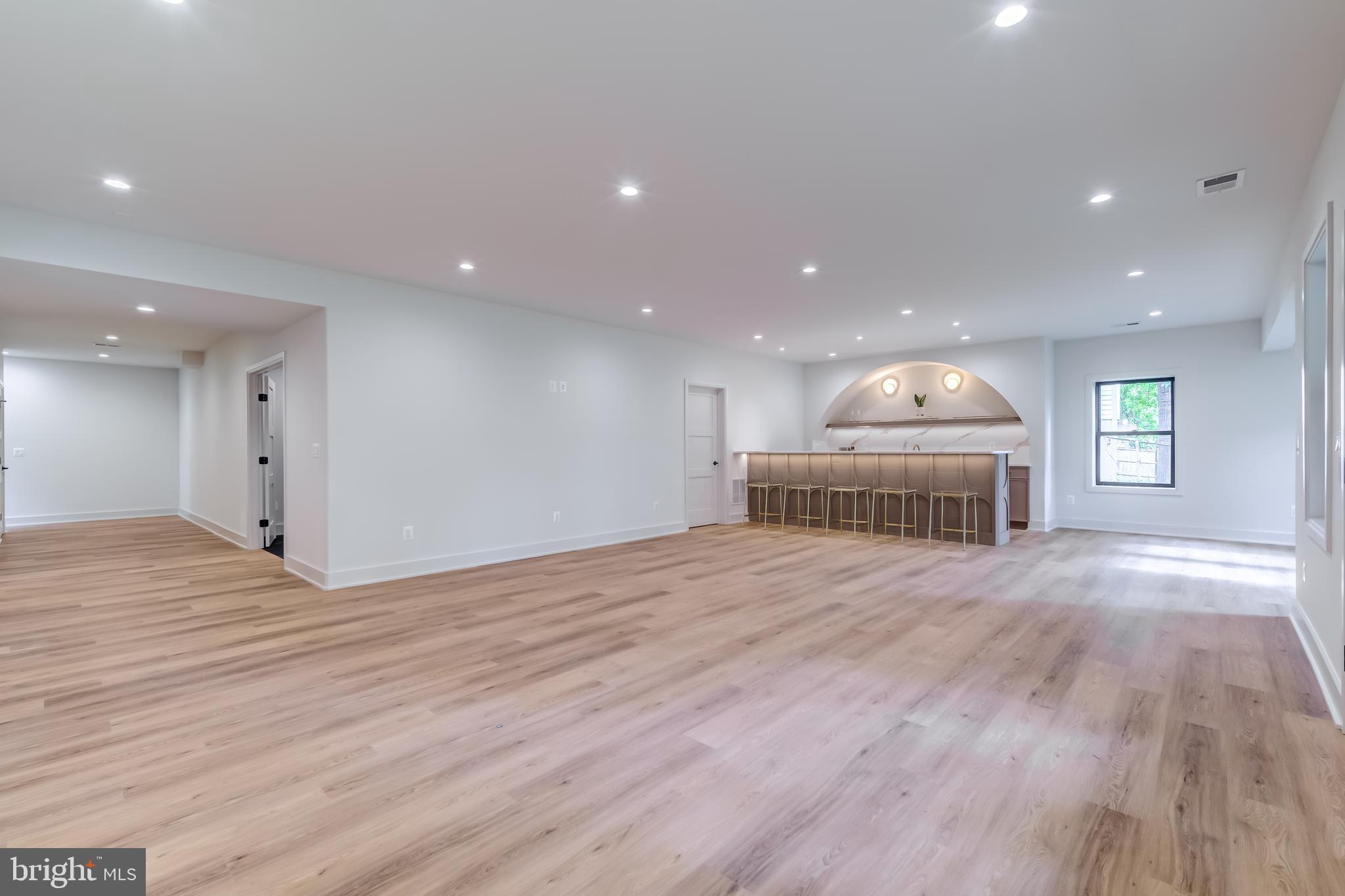 913 Symphony Circle Southwest Vienna, VA 22180 - Photo 118 of 150 a view of empty room with wooden floor and windows